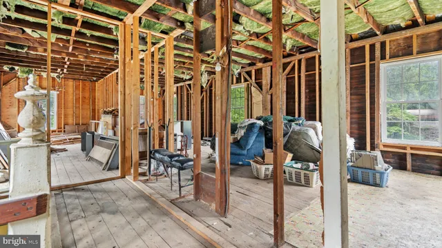 a view of a house with a yard and a garden