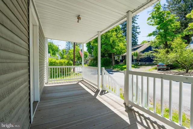 a view of a deck with wooden floor and outdoor space