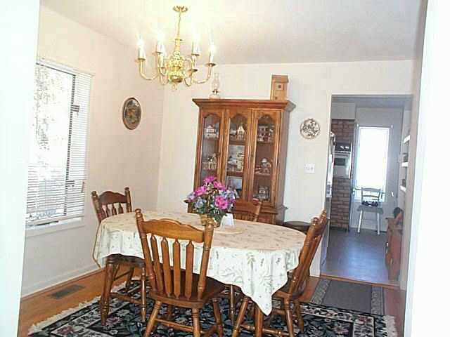 2780 West Longhollow Road Elizabeth, IL 61028 - Photo 3 of 9 a view of a dining room with furniture window and wooden floor