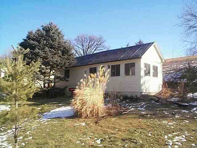 2780 West Longhollow Road Elizabeth, IL 61028 - Photo 6 of 9 a front view of a house with a yard