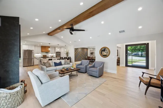 a living room with furniture and a window