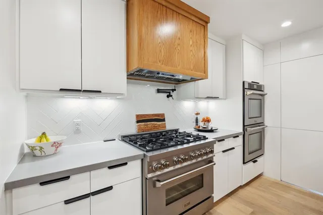 a kitchen with a stove and a refrigerator
