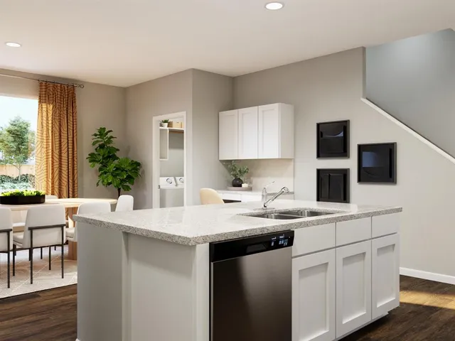 a kitchen with stainless steel appliances granite countertop a sink and a stove