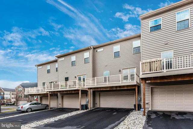 a view of small white building with large windows