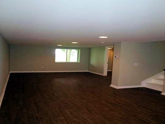 3472 Nonaville Road Mount Juliet, TN 37122 - Photo 11 of 20 Finished basement includes 21'x18' bonus room with walk-in closet, 2nd full bathroom, and access to the 2-car garage! This 380 sq ft area has endless uses and is very comfortable with ground level windows, canned lighting, & luxury vinyl tile floors!
