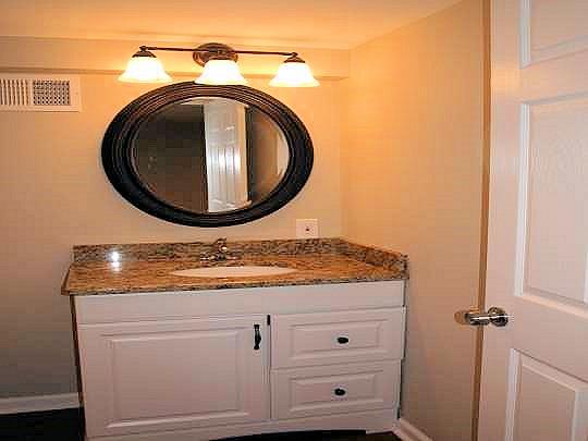 3472 Nonaville Road Mount Juliet, TN 37122 - Photo 12 of 20 9'x7' downstairs bathroom is part of the finished basement, giving this home a 2nd bathroom that is also convenient to the garage! It has a shower stall, 36" vanity with granite counter, wood-grain vinyl tile, classy mirror and lighting!