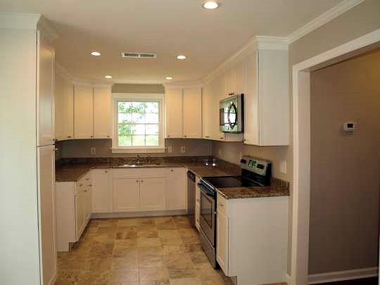 The kitchen was one of the primary focuses of the remodel! Tastefully done in earth tones with beautiful lighting, finishes, & views! Central for entertaining guest in the living room & the deck! Kitchen has an exterior door directly to the deck!!