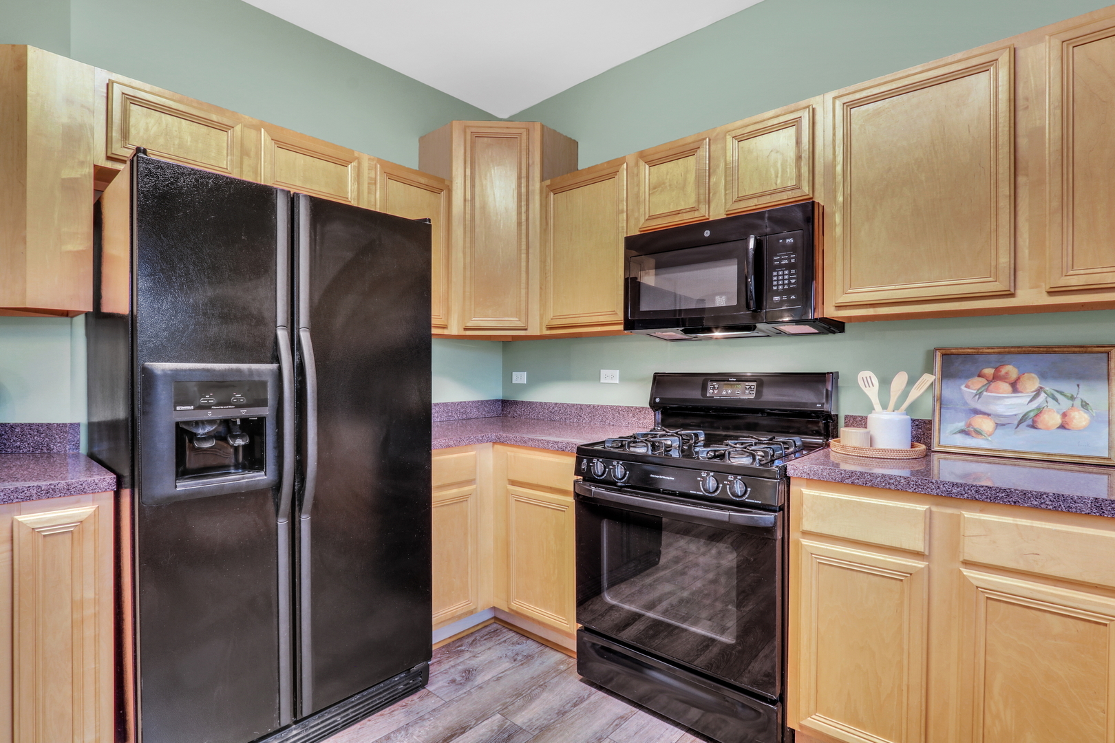 77 Bridle Path Drive Lindenhurst, IL 60046 - Photo 18 of 52 a kitchen with stainless steel appliances granite countertop a refrigerator stove and sink