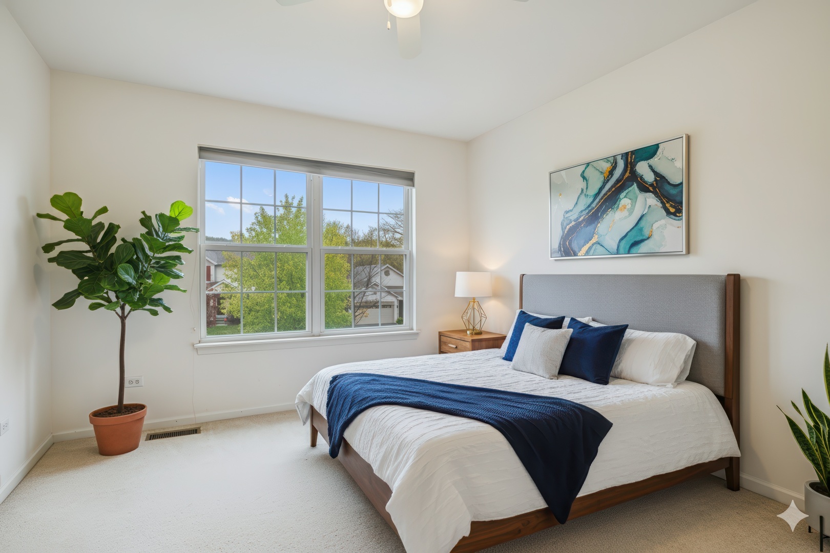 77 Bridle Path Drive Lindenhurst, IL 60046 - Photo 36 of 52 a bedroom with a bed and a potted plant