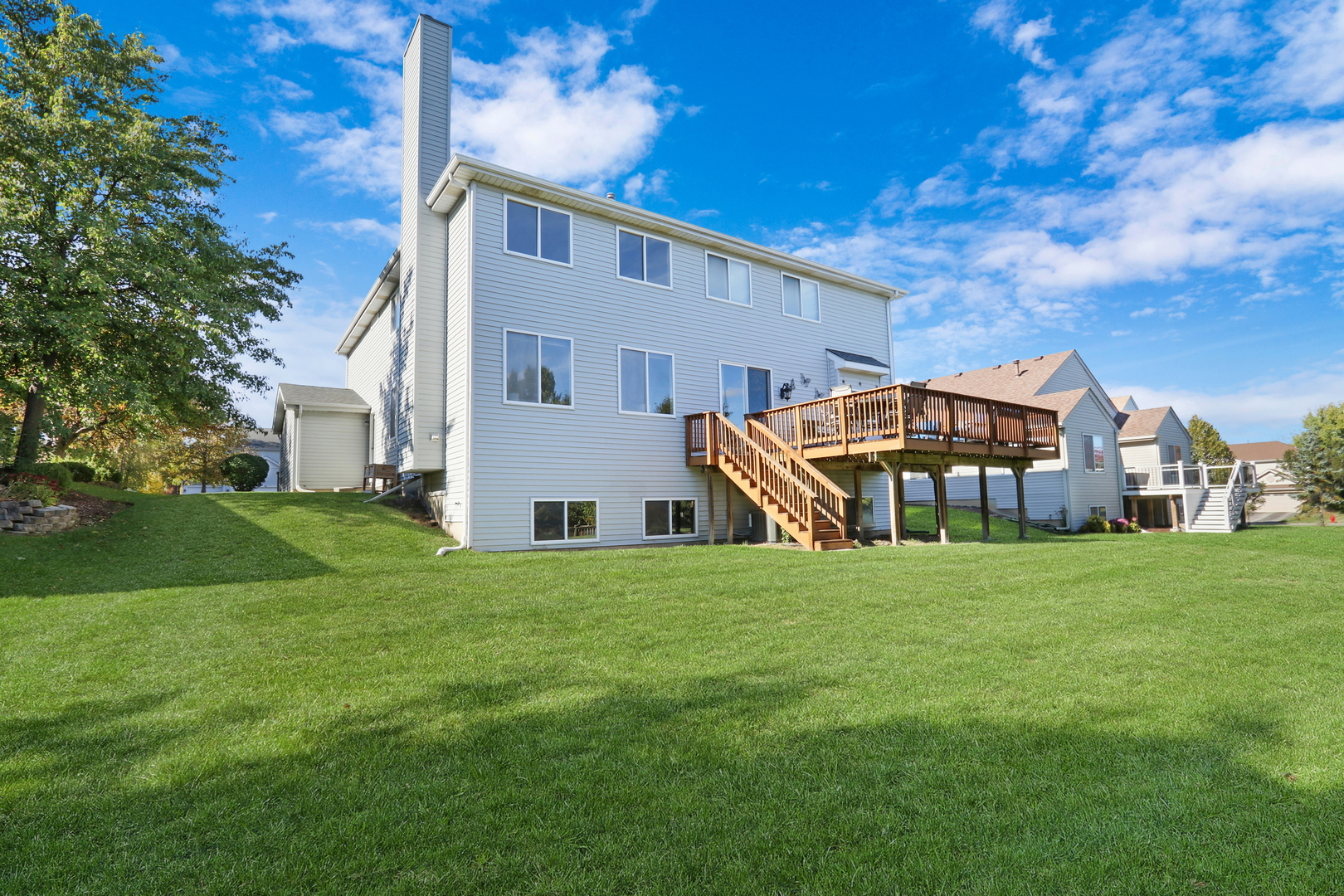 77 Bridle Path Drive Lindenhurst, IL 60046 - Photo 47 of 52 a front view of a house with a yard