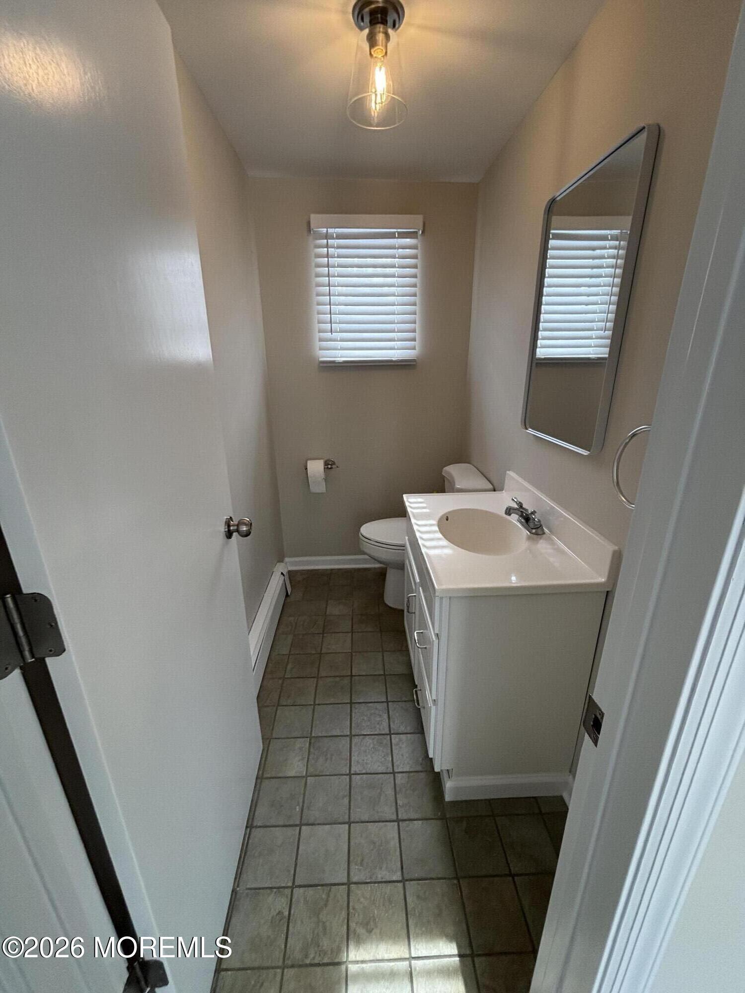 507 Riverside Drive South Brick, NJ 08723 - Photo 15 of 17 a bathroom with a sink a toilet and mirror