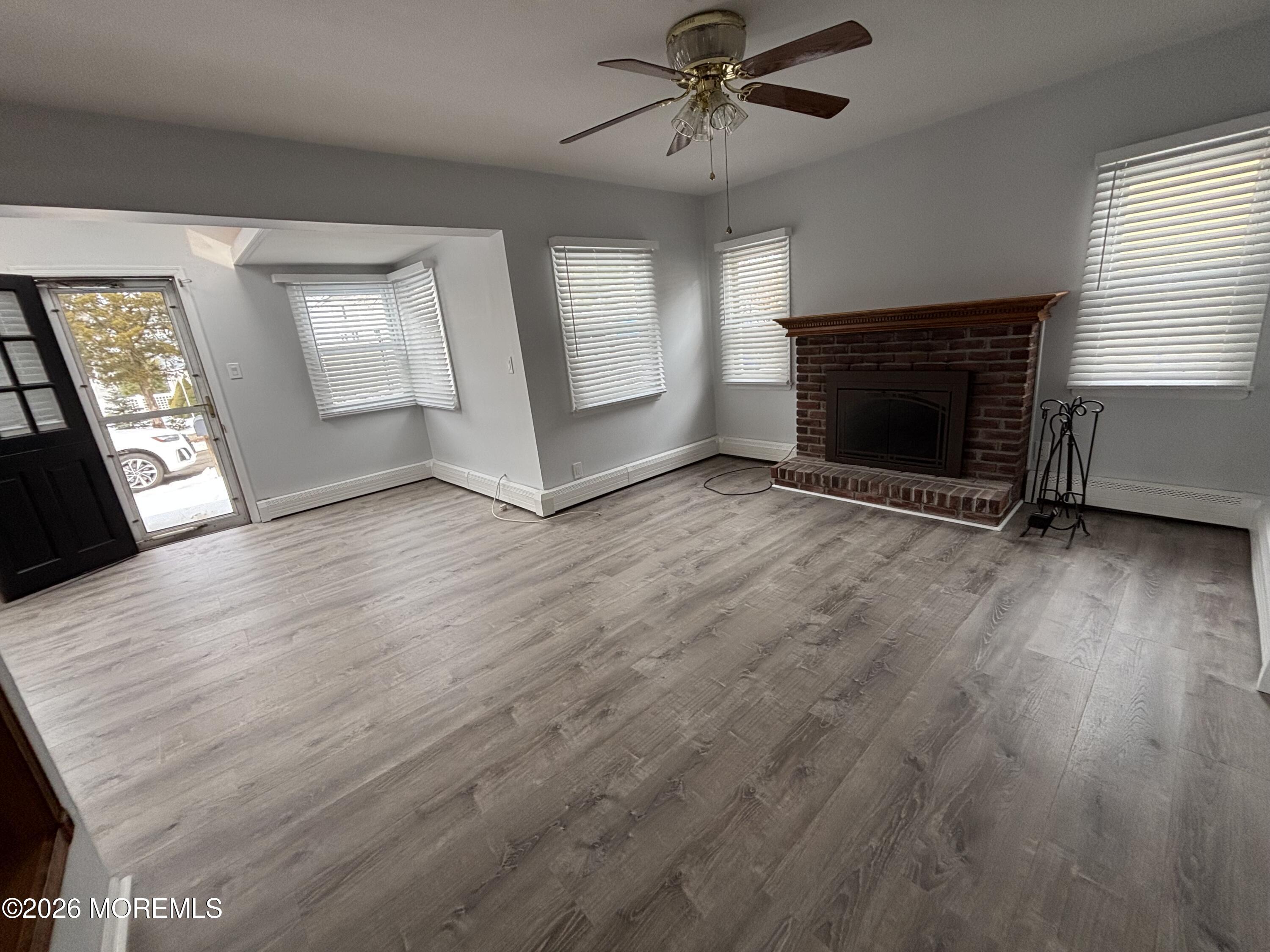 507 Riverside Drive South Brick, NJ 08723 - Photo 16 of 17 an empty room with windows and fireplace