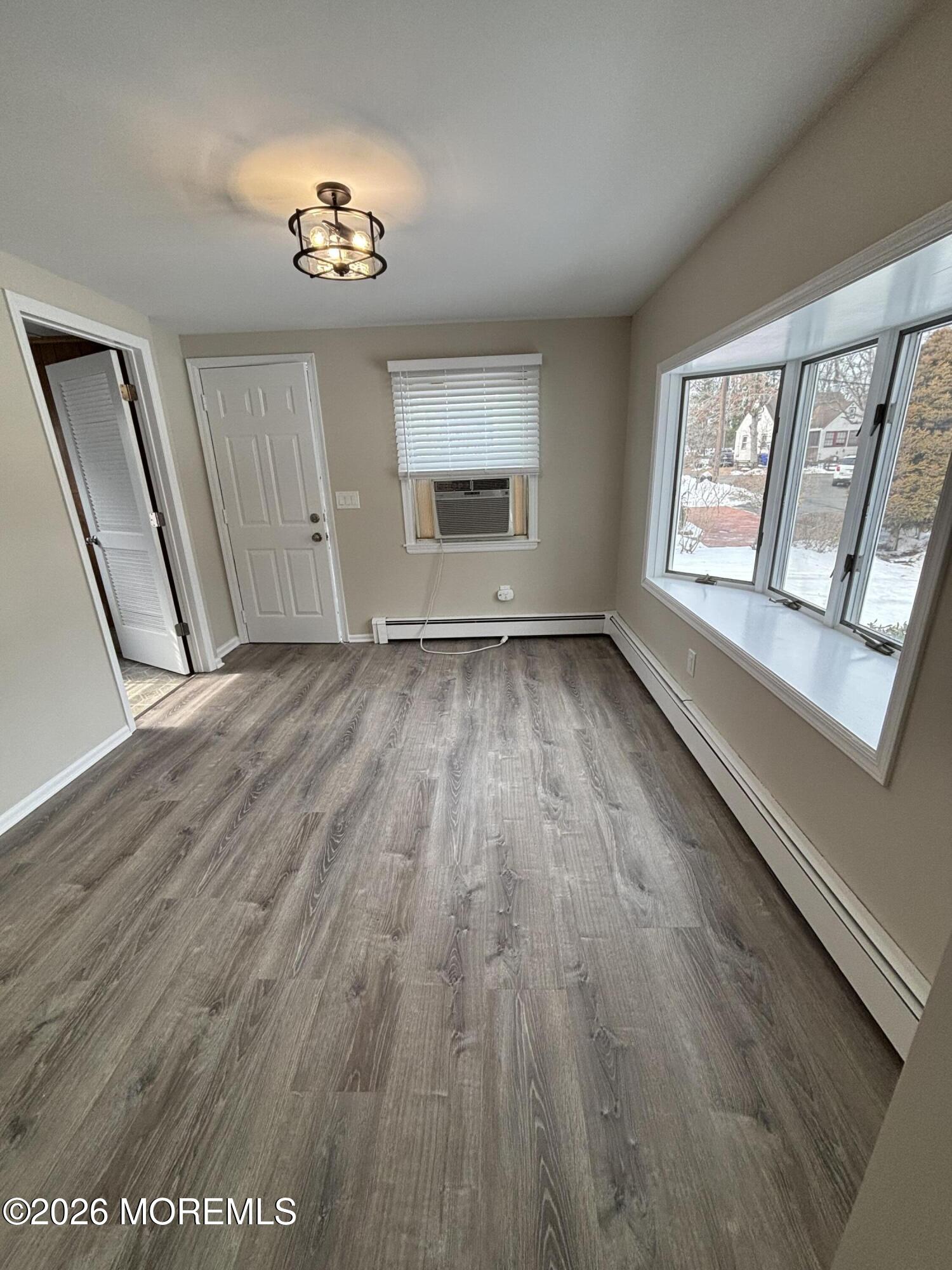 507 Riverside Drive South Brick, NJ 08723 - Photo 6 of 17 wooden floor in an empty room with a window