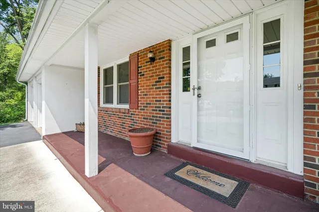a view of a very nice looking room with many windows