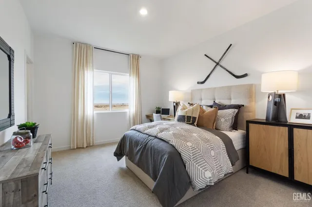 a bedroom with bed and a window