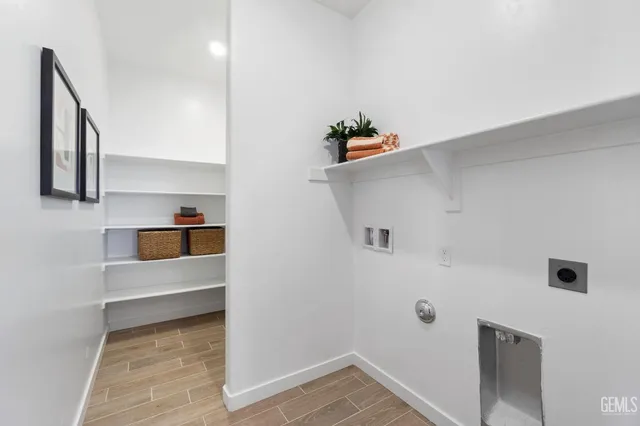 a view of storage and utility room with empty racks