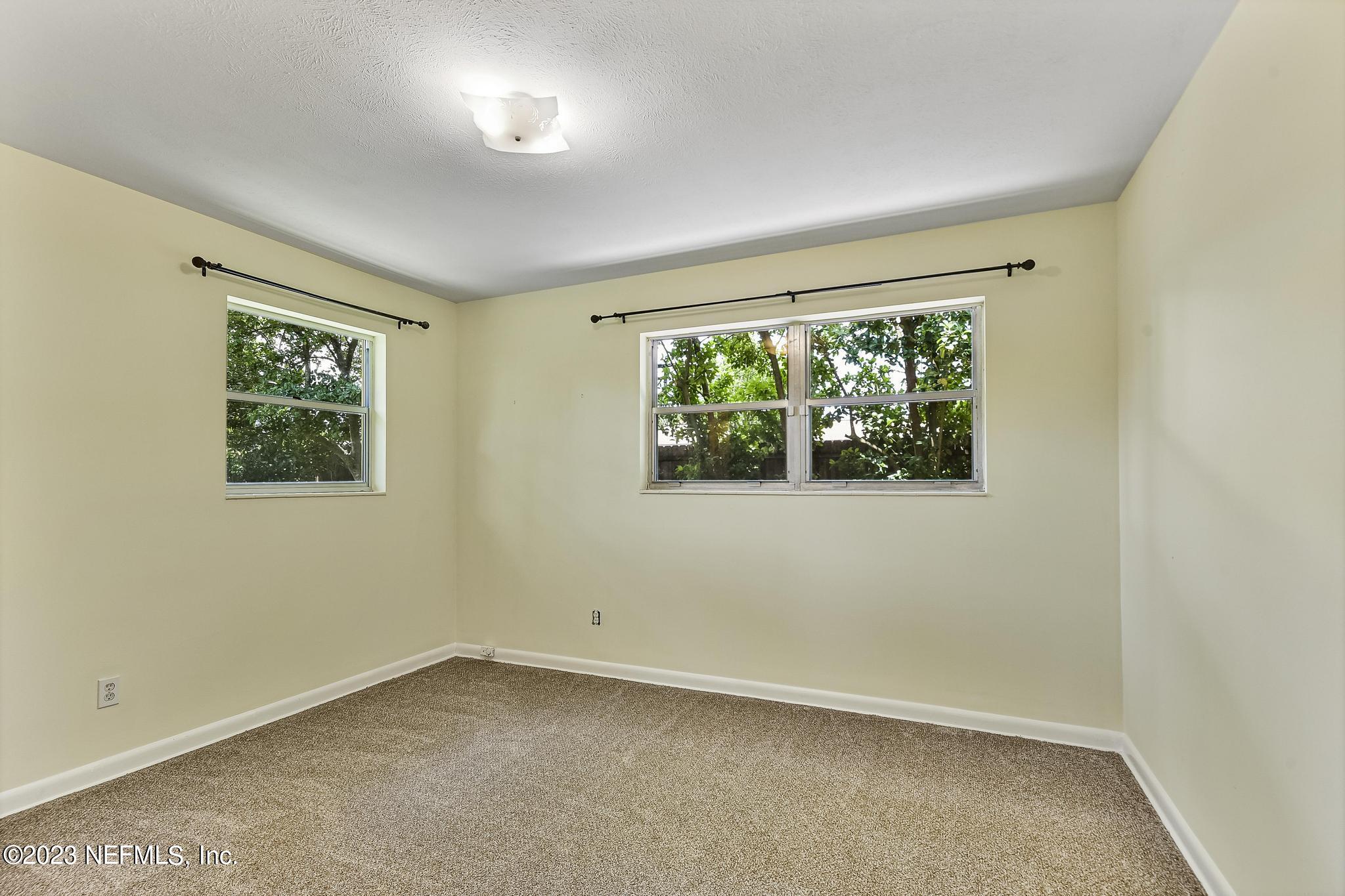 5627 Sabena Road Jacksonville, FL 32207 - Photo 13 of 22 an empty room with a window