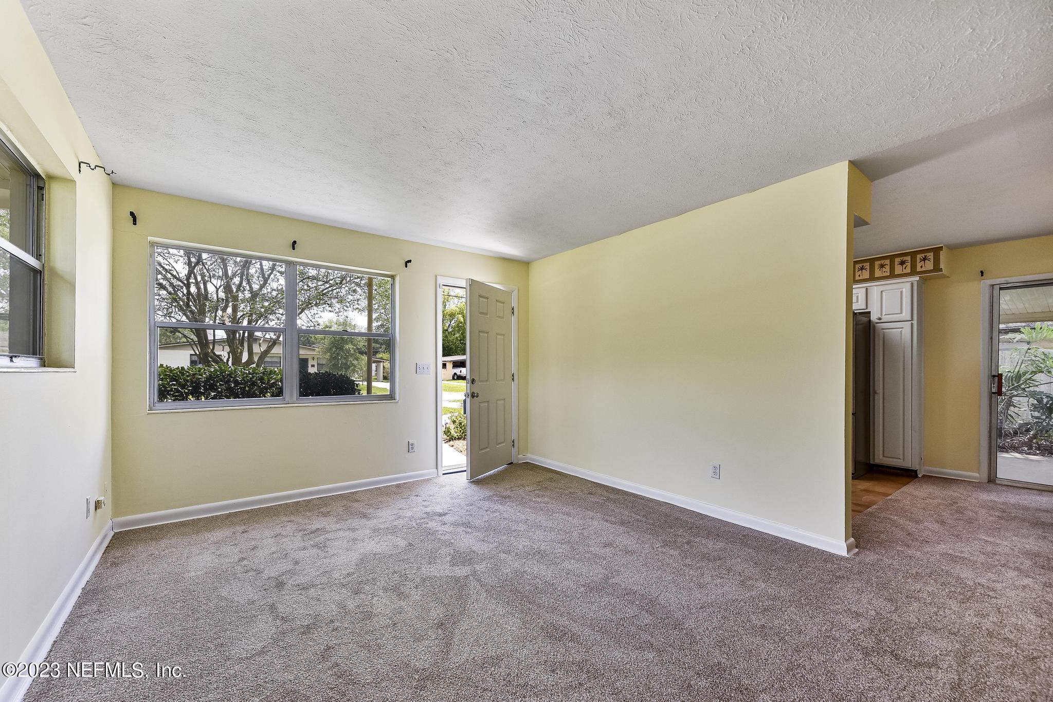 5627 Sabena Road Jacksonville, FL 32207 - Photo 4 of 22 a view of empty room with front door