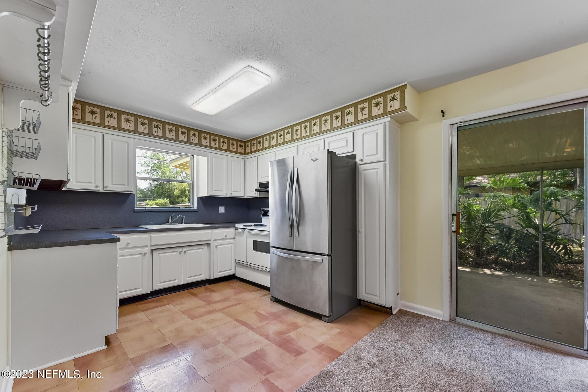 5627 Sabena Road Jacksonville, FL 32207 - Photo 8 of 22 a kitchen with stainless steel appliances granite countertop a refrigerator and a sink