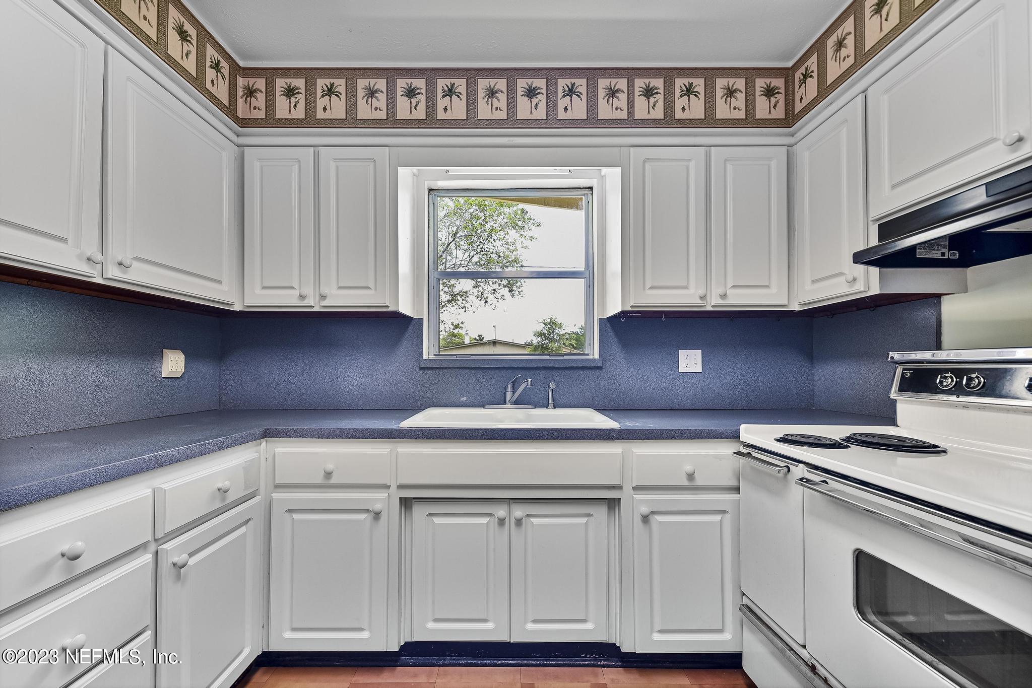5627 Sabena Road Jacksonville, FL 32207 - Photo 10 of 22 a kitchen with stainless steel appliances granite countertop a sink and cabinets