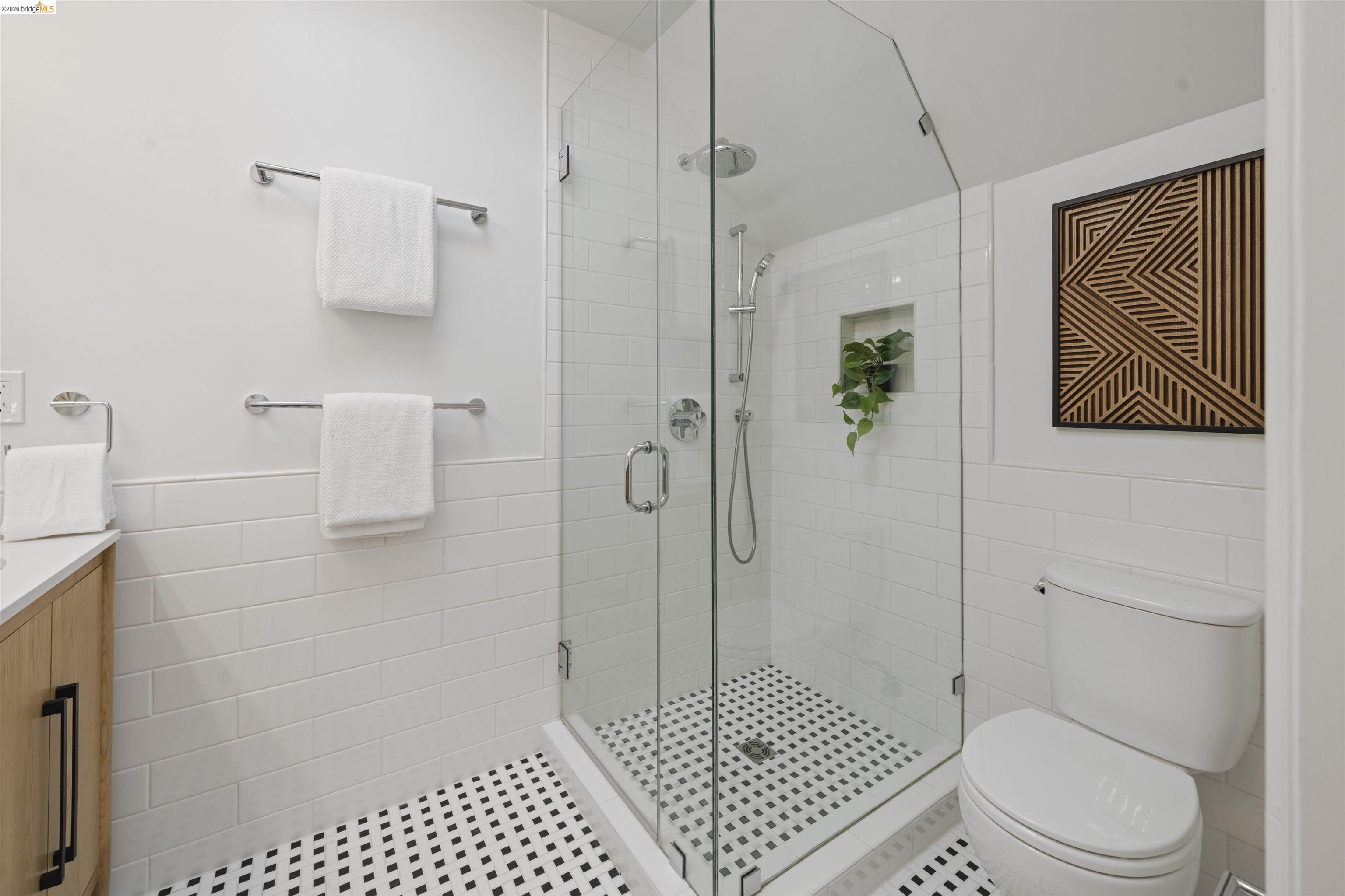 1170 Sterling Avenue Berkeley, CA 94708 - Photo 30 of 52 Bathroom with tile walls, vanity, a stall shower, and a wainscoted wall