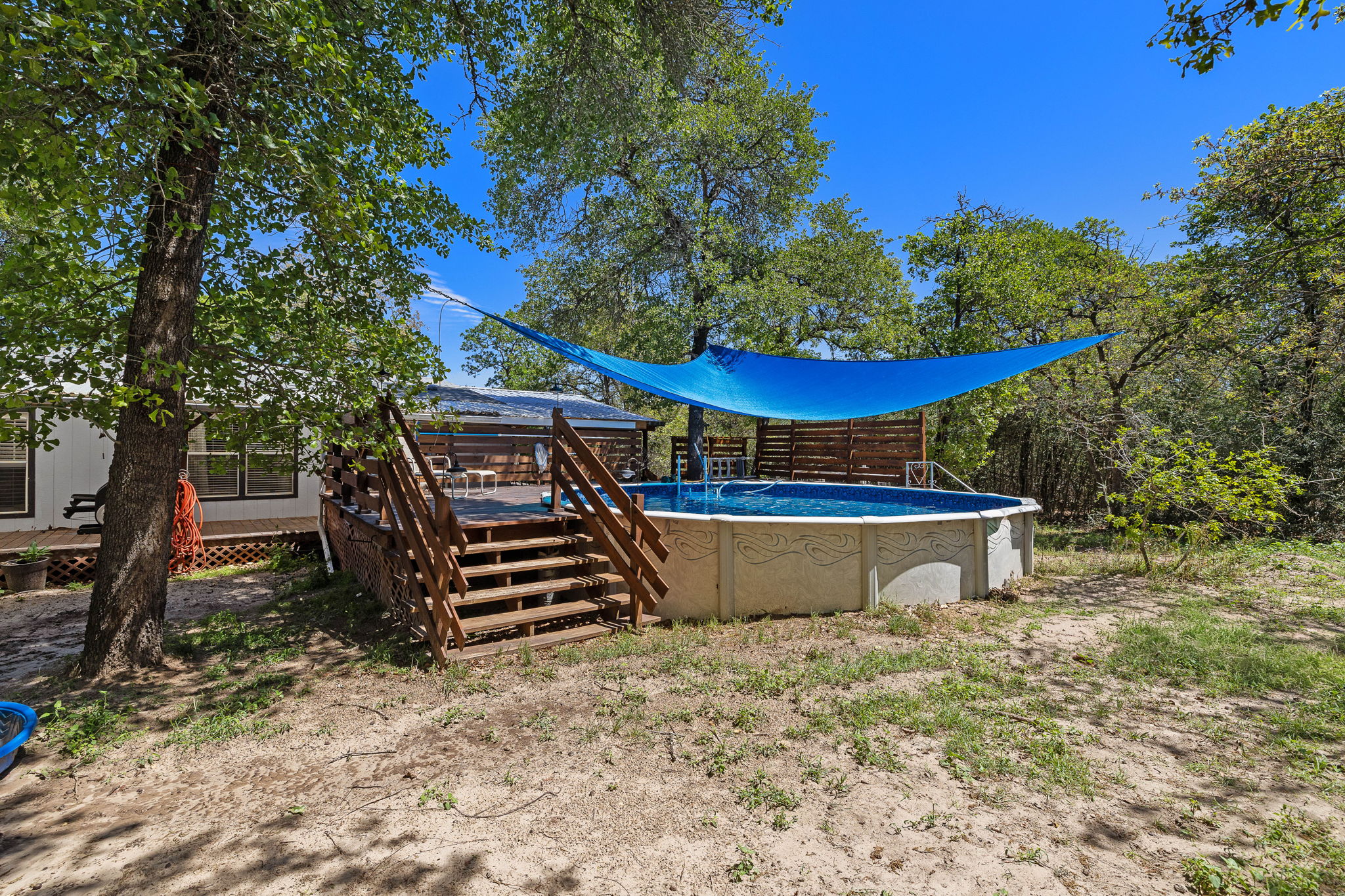 541 Hidden Oaks Drive Elgin, TX 78621 - Photo 34 of 40 Above ground pool with cover and deck