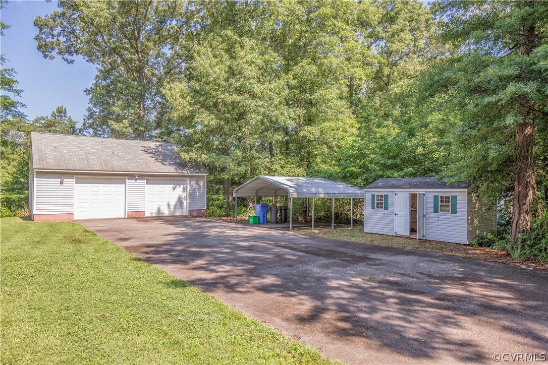 6850 Poplar Springs Road Henrico, VA 23231 - Photo 4 of 26 Storage galore! 2+ car garage, carport, nd shed.