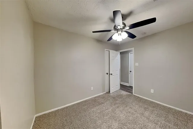 a view of a chandelier fan in a room