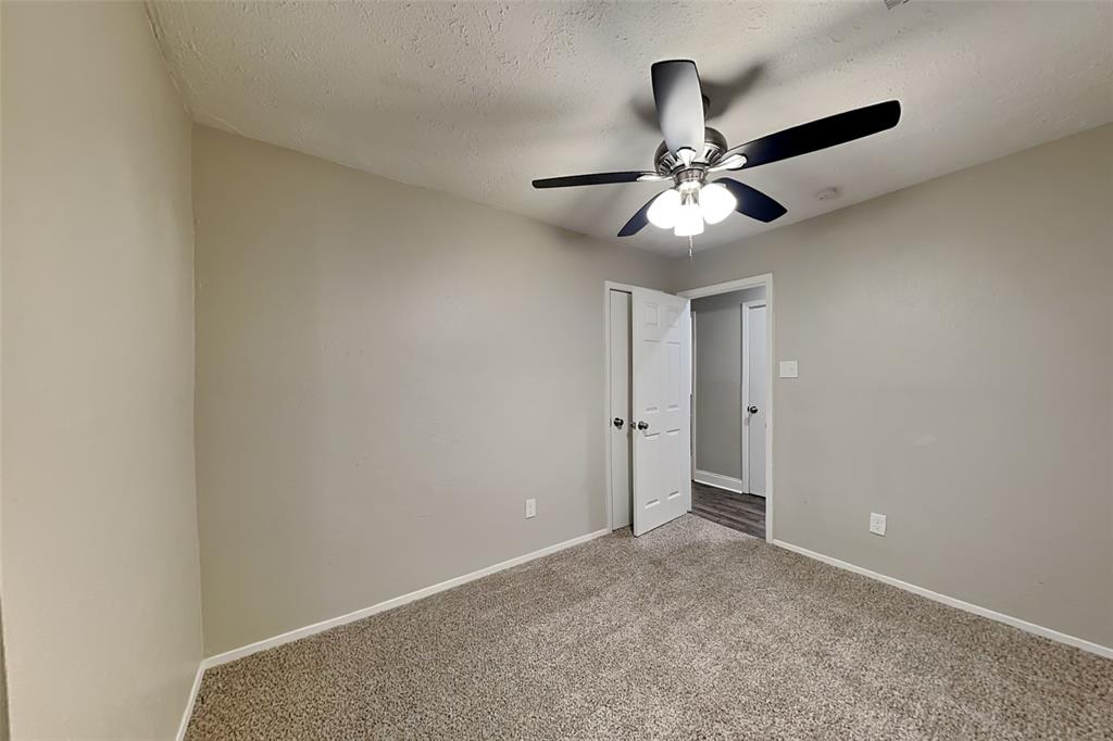 2730 Naples Drive Garland, TX 75040 - Photo 12 of 18 a view of a chandelier fan in a room