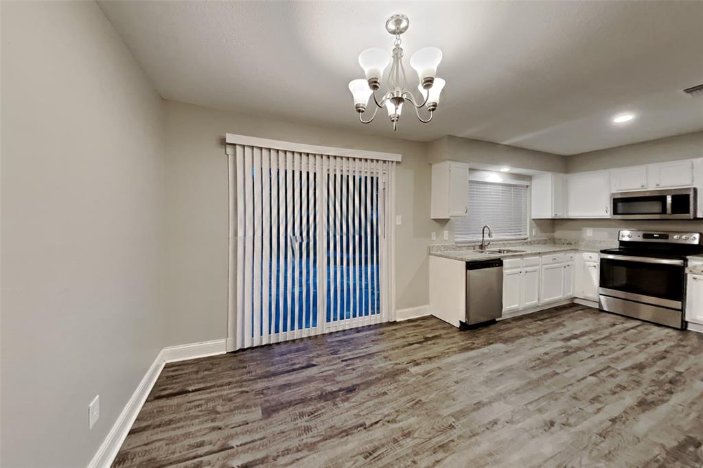 2730 Naples Drive Garland, TX 75040 - Photo 6 of 18 a view of kitchen with sink and wooden floor