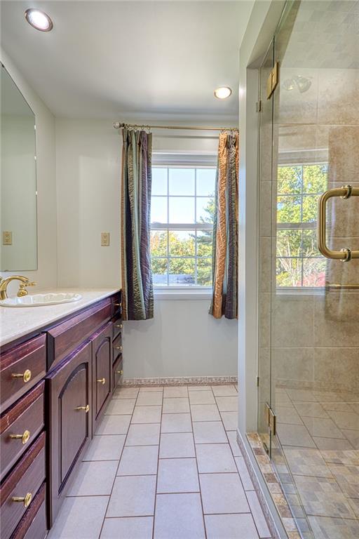 1608 Seegar Road Pittsburgh, PA 15241 - Photo 12 of 24 a spacious bathroom with a granite countertop sink a mirror and next to a window
