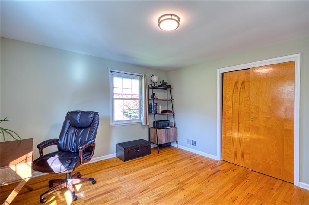 1608 Seegar Road Pittsburgh, PA 15241 - Photo 16 of 24 a bedroom with a bed and wooden floor
