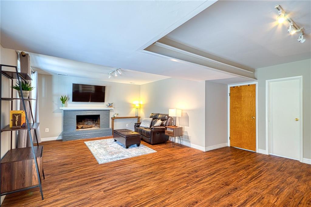 1608 Seegar Road Pittsburgh, PA 15241 - Photo 18 of 24 a living room with furniture and a fireplace
