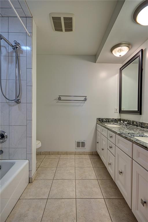 1608 Seegar Road Pittsburgh, PA 15241 - Photo 21 of 24 a bathroom with a granite countertop sink a toilet and bathtub