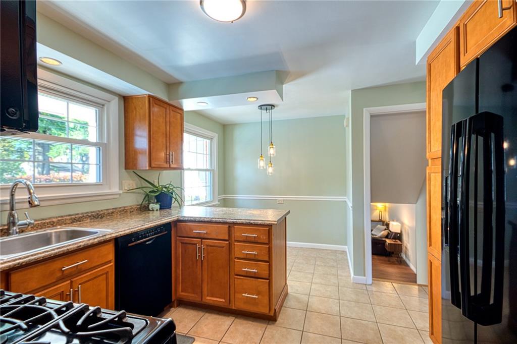 1608 Seegar Road Pittsburgh, PA 15241 - Photo 8 of 24 a kitchen with a sink and a stove top oven
