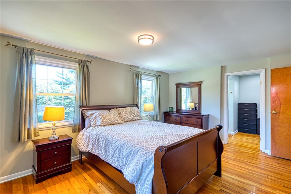 1608 Seegar Road Pittsburgh, PA 15241 - Photo 10 of 24 a bed room with a bed and a lamp on desk