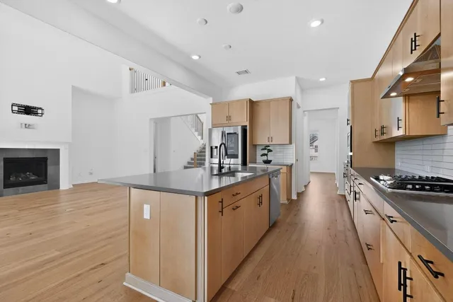 a view of a lush green outdoor space with a lake view