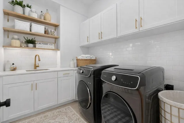 a bathroom with a sink toilet vanity and shower