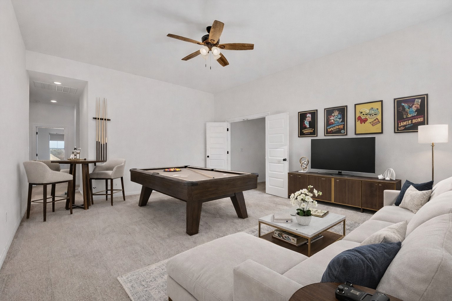 7705 Alouette Drive Austin, TX 78738 - Photo 28 of 40 a living room with furniture a rug and a flat screen tv