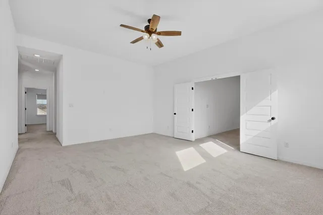 a living room with furniture a rug and a flat screen tv