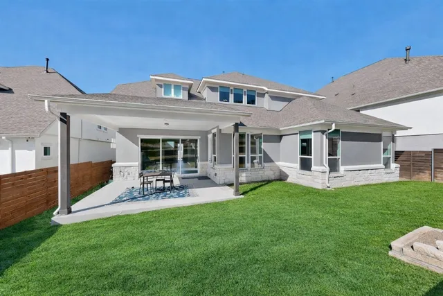 an empty room with closet and fan