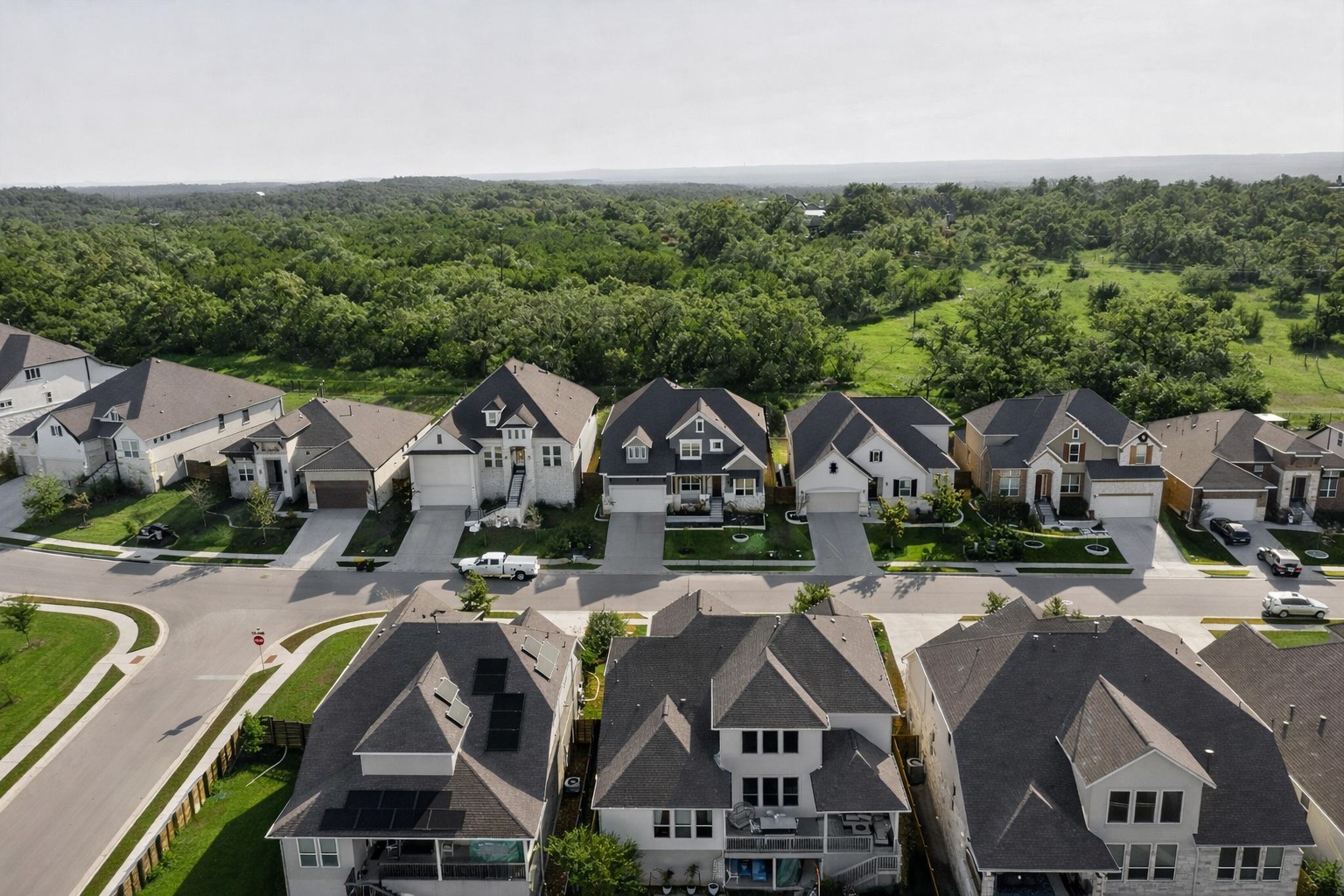 7705 Alouette Drive Austin, TX 78738 - Photo 33 of 40 an aerial view of a house with swimming pool and mountains