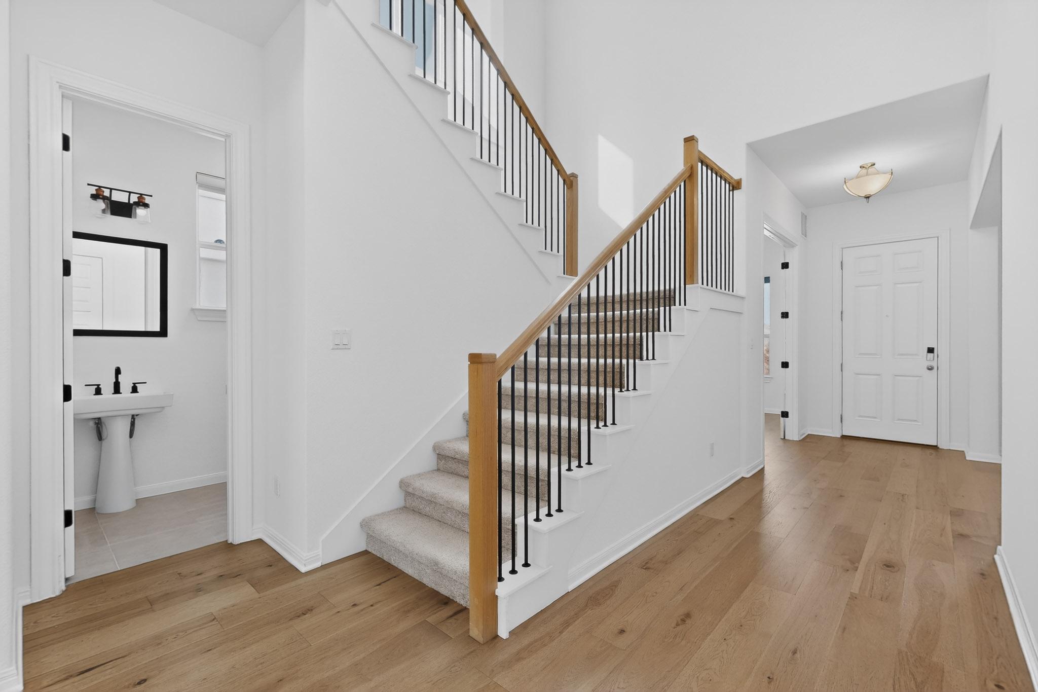 7705 Alouette Drive Austin, TX 78738 - Photo 4 of 40 a view of a hallway with wooden floor and entryway