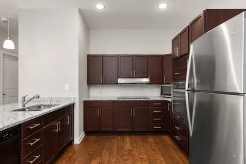 a kitchen with a sink and a refrigerator