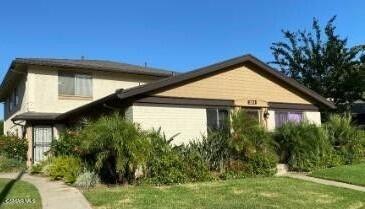 2014 Avenida Placida, Unit 4 Simi Valley, CA 93063 - Photo 1 of 12 a view of house with a yard