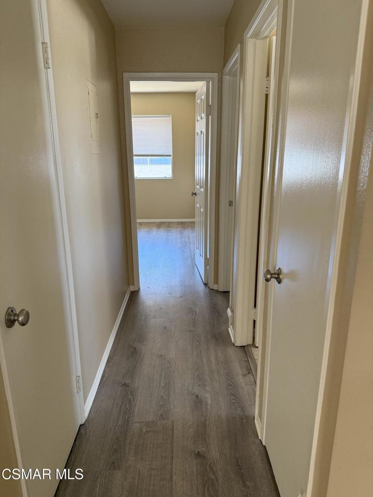 2014 Avenida Placida, Unit 4 Simi Valley, CA 93063 - Photo 6 of 12 a view of a hallway with wooden floor