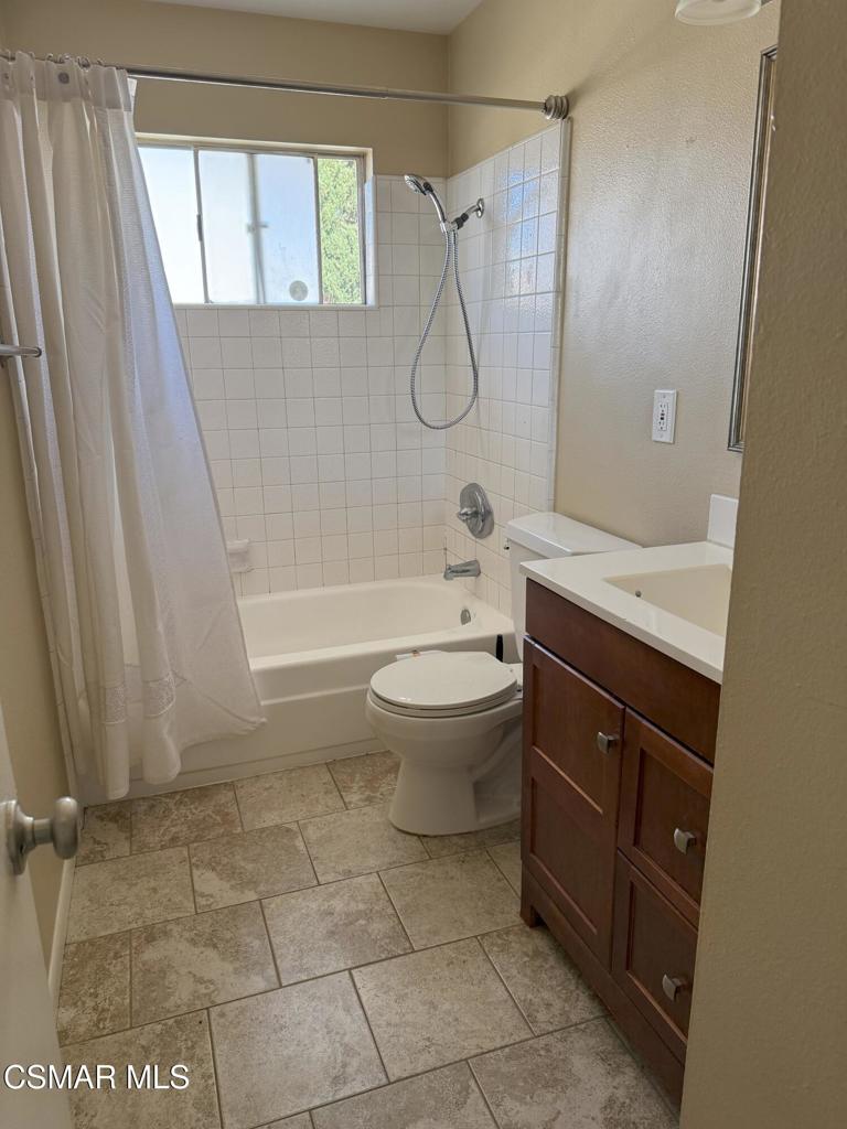 2014 Avenida Placida, Unit 4 Simi Valley, CA 93063 - Photo 8 of 12 a bathroom with a granite countertop sink toilet and shower