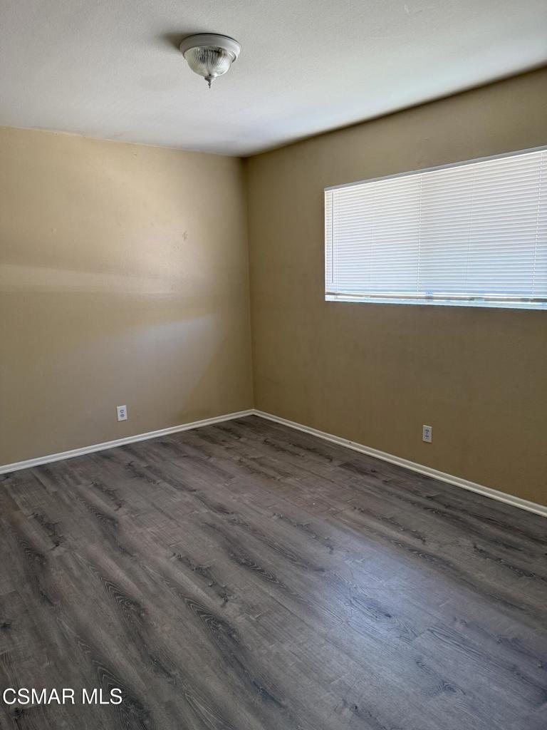 2014 Avenida Placida, Unit 4 Simi Valley, CA 93063 - Photo 9 of 12 an empty room with wooden floor