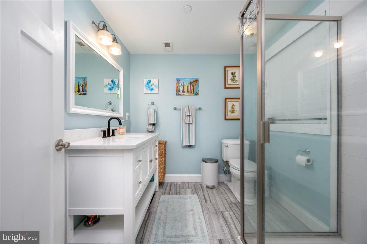 57 Spa Road Annapolis, MD 21401 - Photo 23 of 39 a spacious bathroom with a double vanity sink toilet and shower