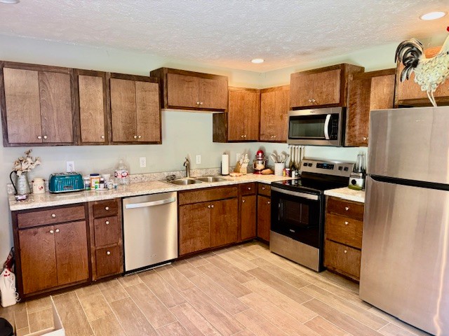 1316 Old Cowan Road Winchester, TN 37398 - Photo 17 of 23 a kitchen with a sink cabinets and stainless steel appliances